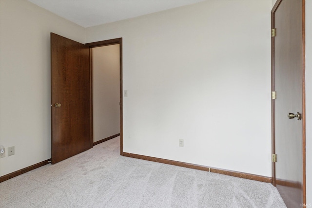 unfurnished bedroom with light carpet