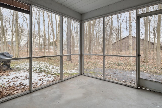 unfurnished sunroom with a wealth of natural light