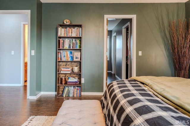 bedroom with dark wood-type flooring