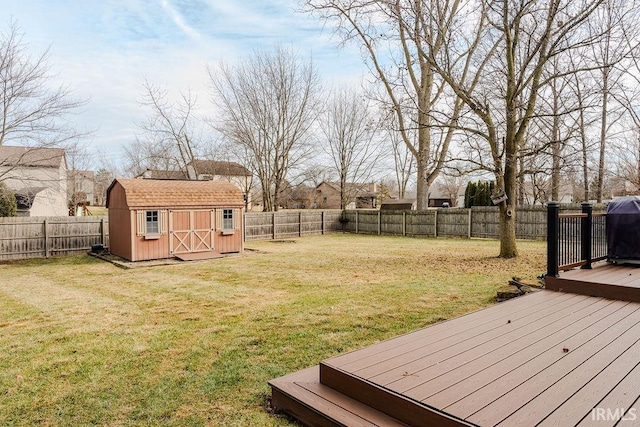 view of yard featuring a storage shed and a deck