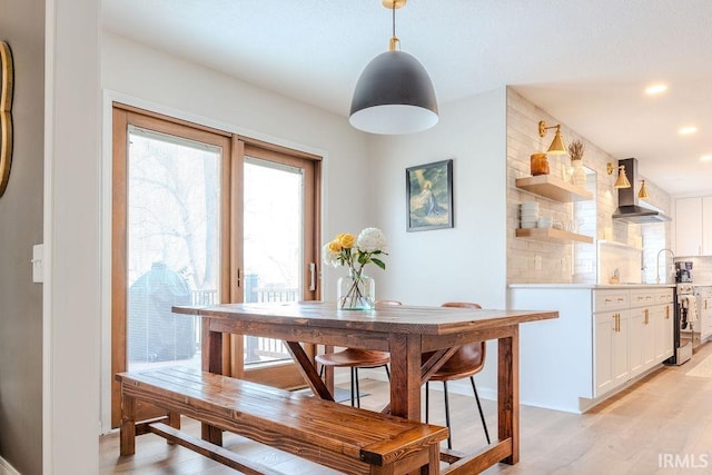 dining space featuring light hardwood / wood-style floors