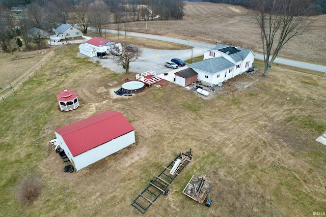 birds eye view of property with a rural view