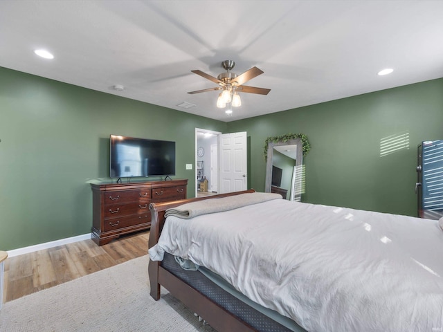 bedroom featuring light hardwood / wood-style floors and ceiling fan