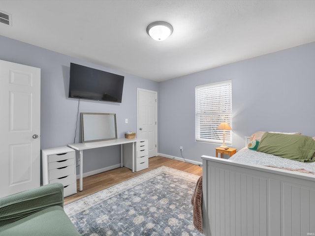 bedroom with light hardwood / wood-style flooring