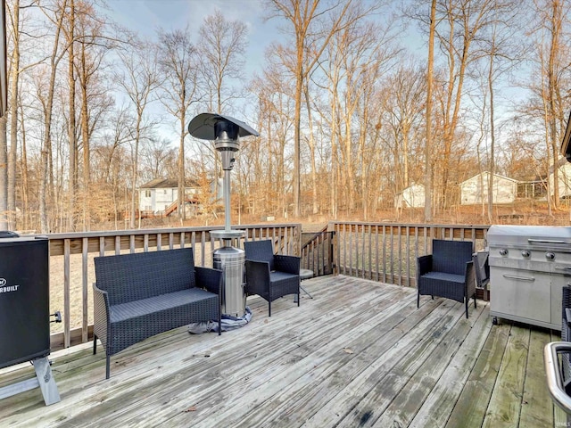 wooden terrace with an outdoor living space and a grill