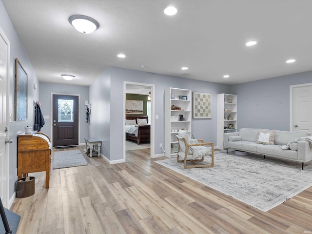 living room with light hardwood / wood-style flooring