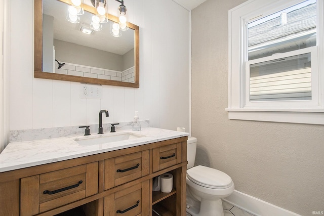 bathroom with vanity and toilet