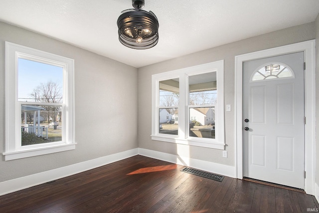 foyer featuring dark hardwood / wood-style floors