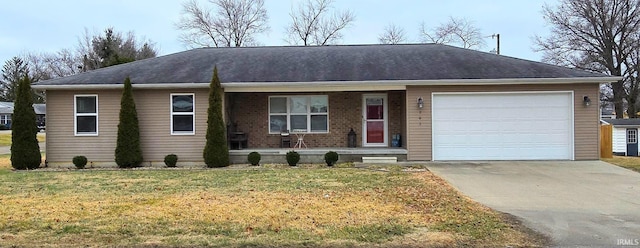 ranch-style home with a garage and a front lawn