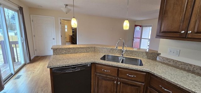 kitchen with dark brown cabinetry, sink, light stone counters, decorative light fixtures, and dishwasher