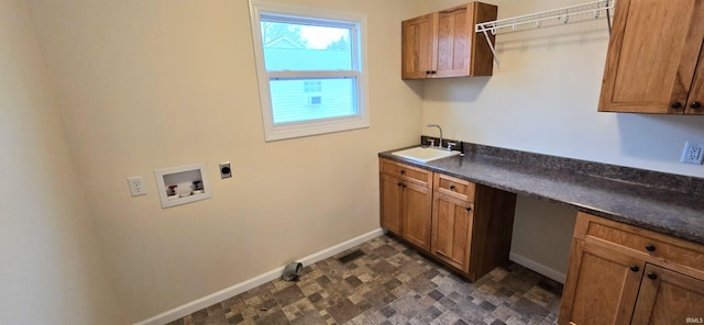 clothes washing area with sink, hookup for a washing machine, cabinets, and hookup for an electric dryer