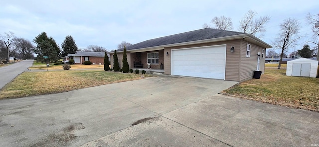 view of front of property with a storage shed, a garage, and a front lawn