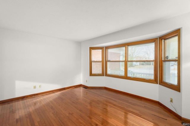 empty room featuring hardwood / wood-style floors