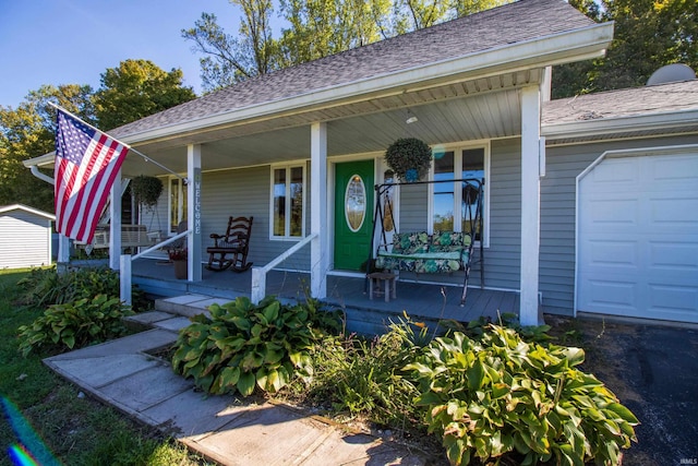 view of front of property with a porch and a garage