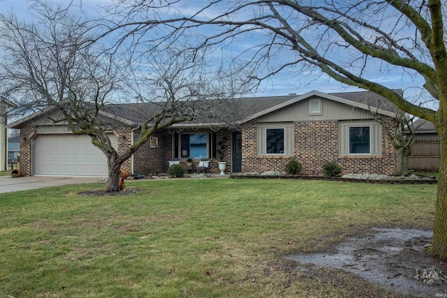 ranch-style home featuring a garage and a front yard