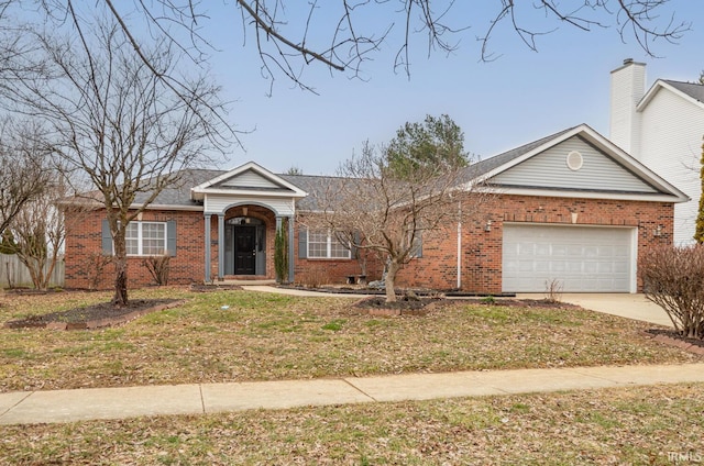 ranch-style house featuring a garage and a front lawn