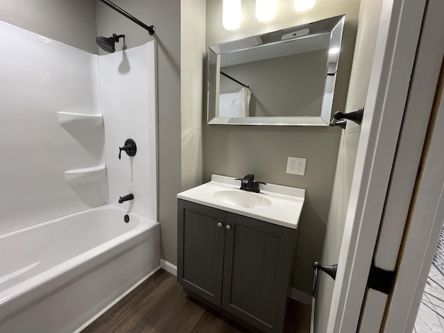 bathroom featuring shower / bath combo, hardwood / wood-style floors, and vanity