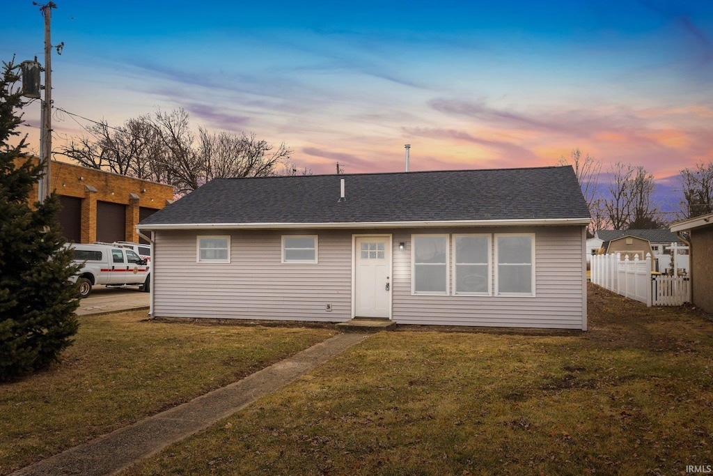 view of front of home featuring a yard