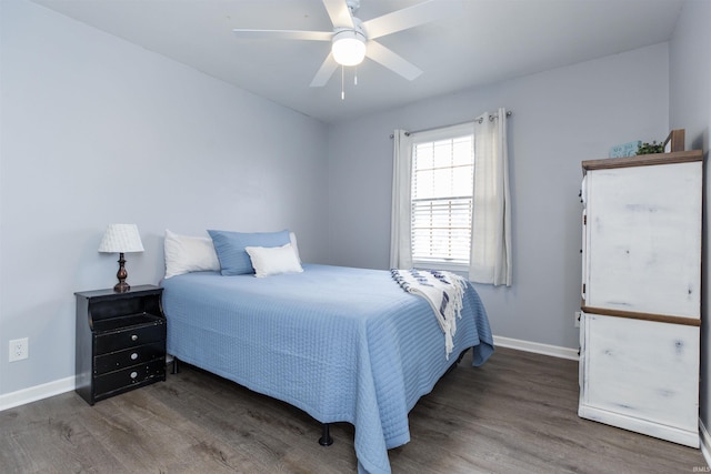 bedroom featuring dark hardwood / wood-style flooring and ceiling fan