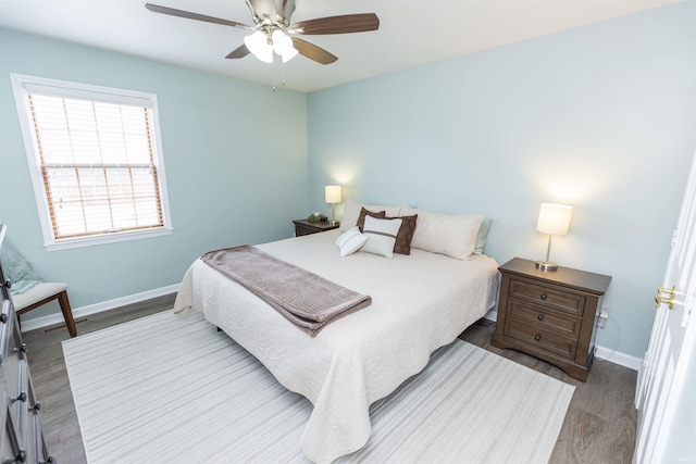 bedroom featuring hardwood / wood-style flooring and ceiling fan