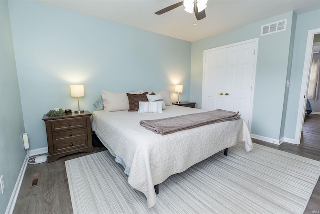 bedroom with hardwood / wood-style flooring, ceiling fan, and a closet