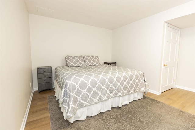 bedroom with hardwood / wood-style flooring