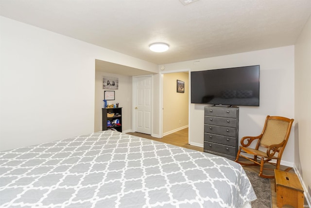 bedroom with wood-type flooring