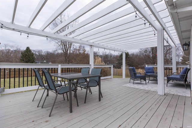 deck featuring an outdoor living space and a pergola