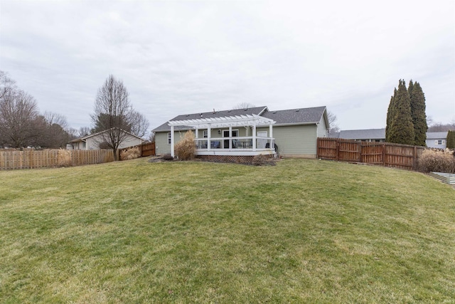 rear view of house featuring a yard and a pergola