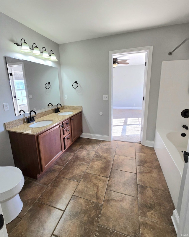 full bathroom with ceiling fan, vanity, toilet, and shower / bath combination