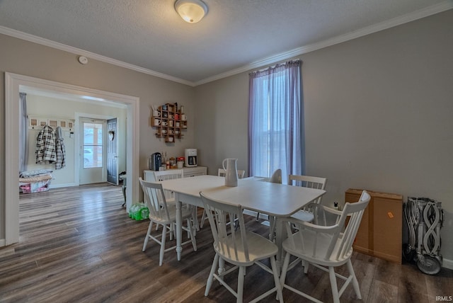 dining area featuring crown molding, dark hardwood / wood-style floors, and a textured ceiling