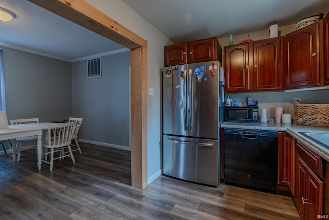 kitchen featuring dark hardwood / wood-style flooring, ornamental molding, and black appliances