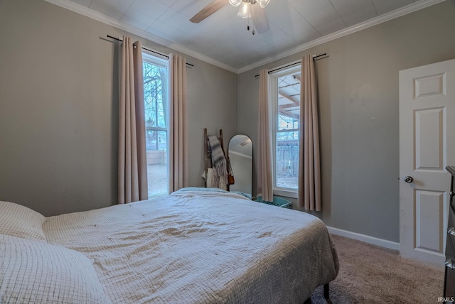 bedroom with crown molding, ceiling fan, and carpet