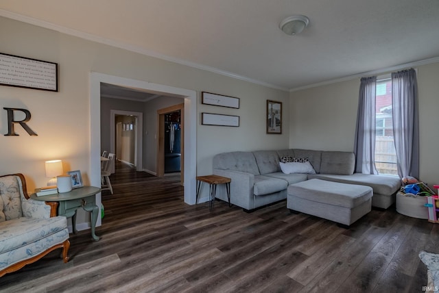 living room featuring dark hardwood / wood-style flooring and crown molding