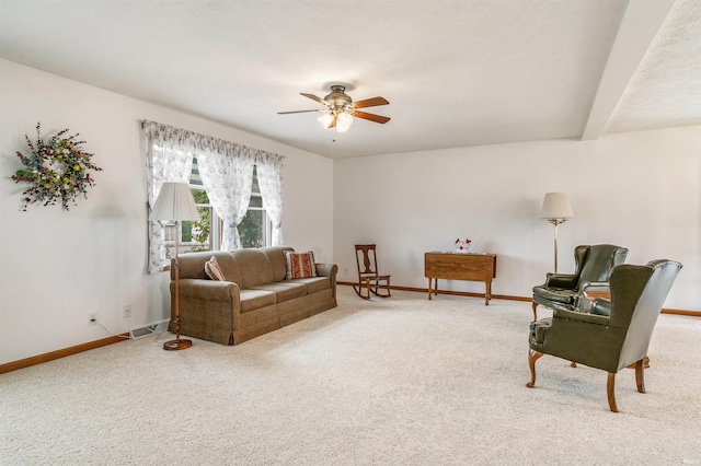 living room featuring ceiling fan and carpet flooring