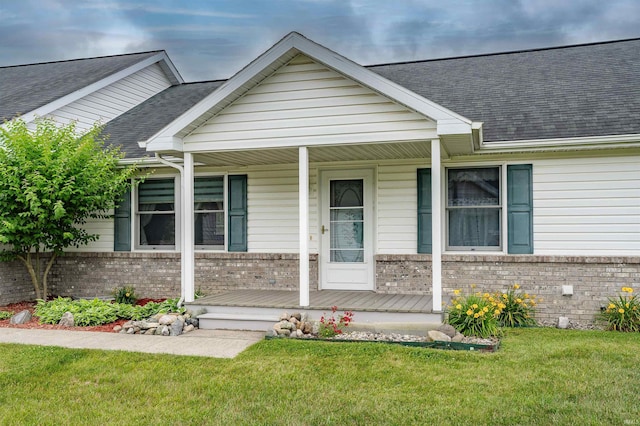 view of front facade with a front yard and a porch