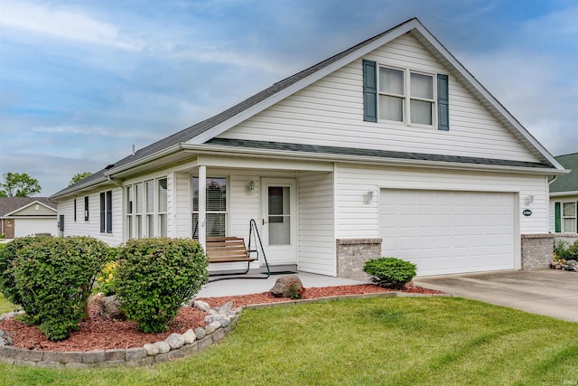 view of front of home with a garage, a front lawn, and a porch