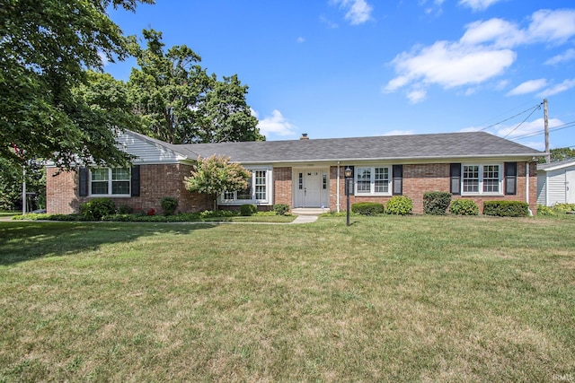 ranch-style house featuring a front lawn