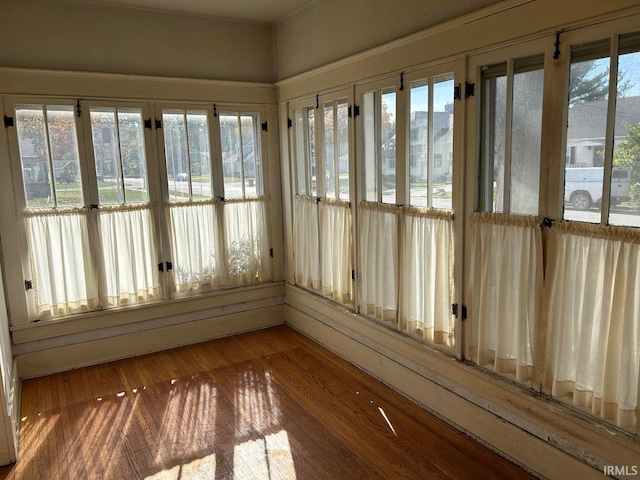 unfurnished sunroom with plenty of natural light