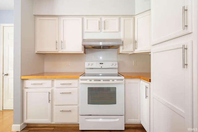 kitchen featuring wood-type flooring, ventilation hood, white electric stove, and white cabinets