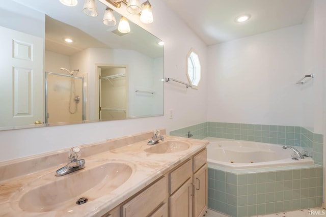 bathroom featuring independent shower and bath and vanity