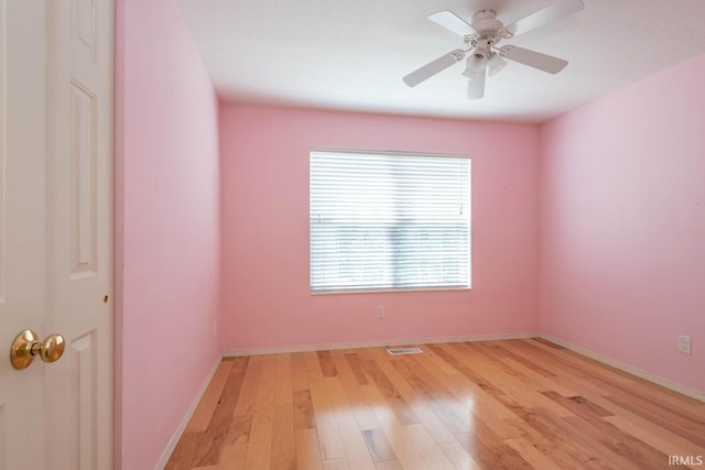 unfurnished room with ceiling fan and light hardwood / wood-style flooring