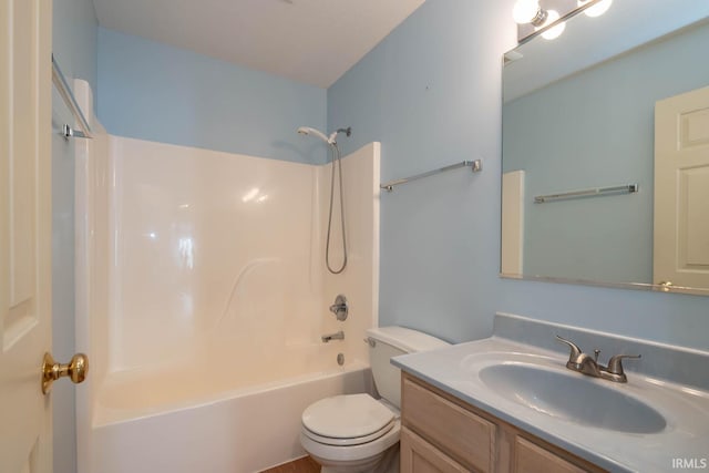 full bathroom with vanity, toilet, and washtub / shower combination