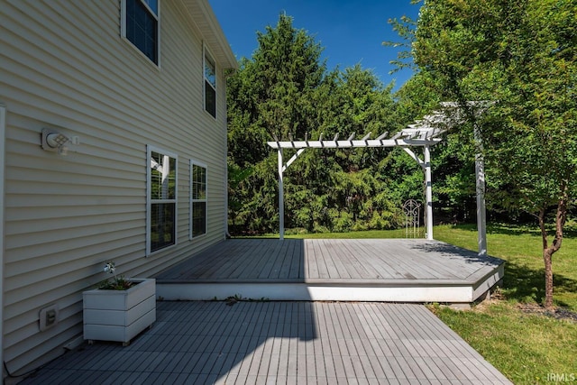 wooden deck with a pergola and a lawn