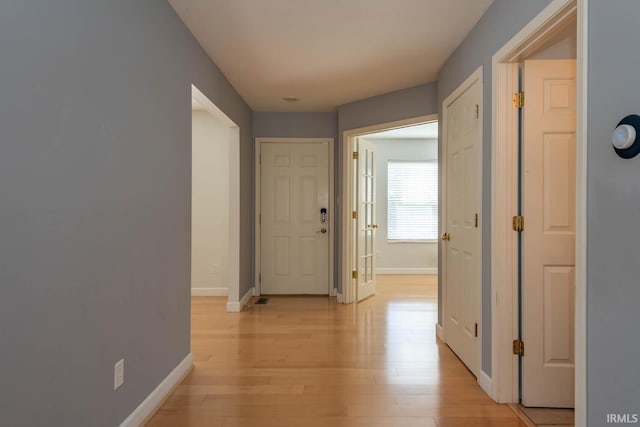 corridor featuring light hardwood / wood-style flooring