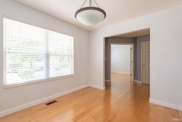 spare room featuring hardwood / wood-style floors