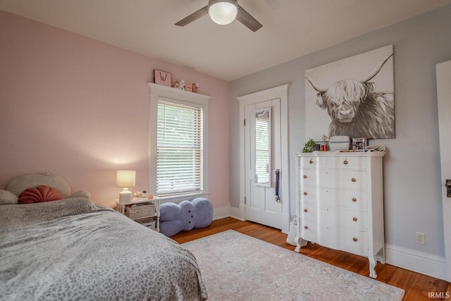 bedroom with ceiling fan and wood-type flooring