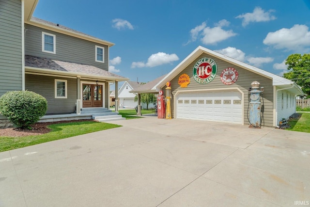 front facade featuring french doors and a garage