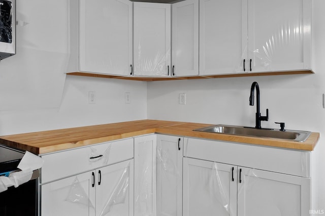 kitchen with sink and white cabinets