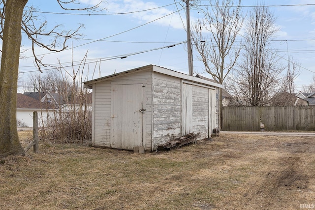 view of outdoor structure featuring a lawn